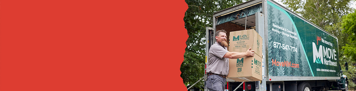 Move Northwest employee unloading a Moving Box from a branded Moving Truck during a relocation.